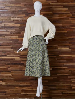 Cover your lower body with a cropped knit and mid-length voluminous skirt