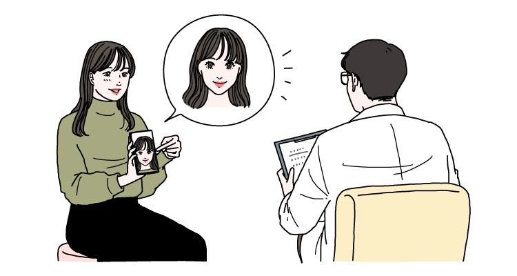 理想の容姿をクリニックの医師に相談している女性